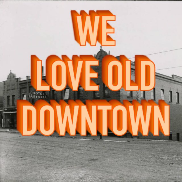 Black and white photo of historic downtown buildings with bold orange 3D text overlaid that reads, "WE LOVE OLD DOWNTOWN.