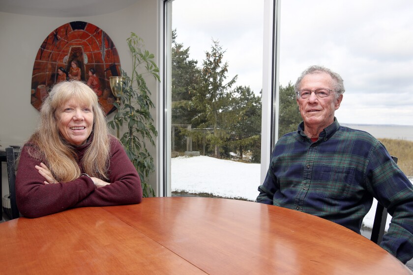 Couple sitting at a table.