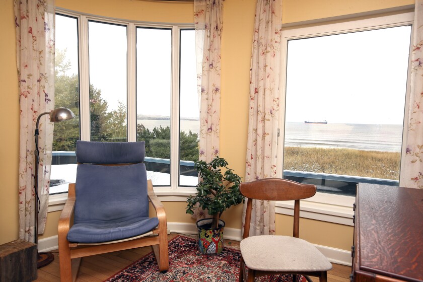 Curved window in a bedroom.